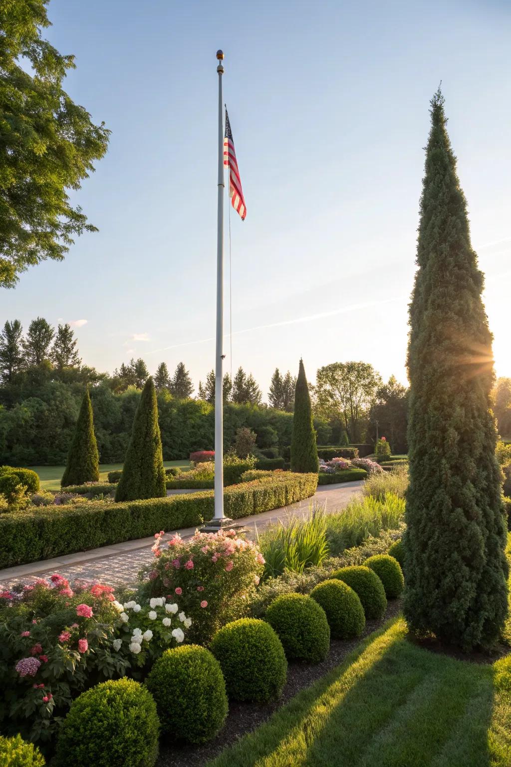 Evergreen shrubs ensure a neat and vibrant flagpole area year-round.
