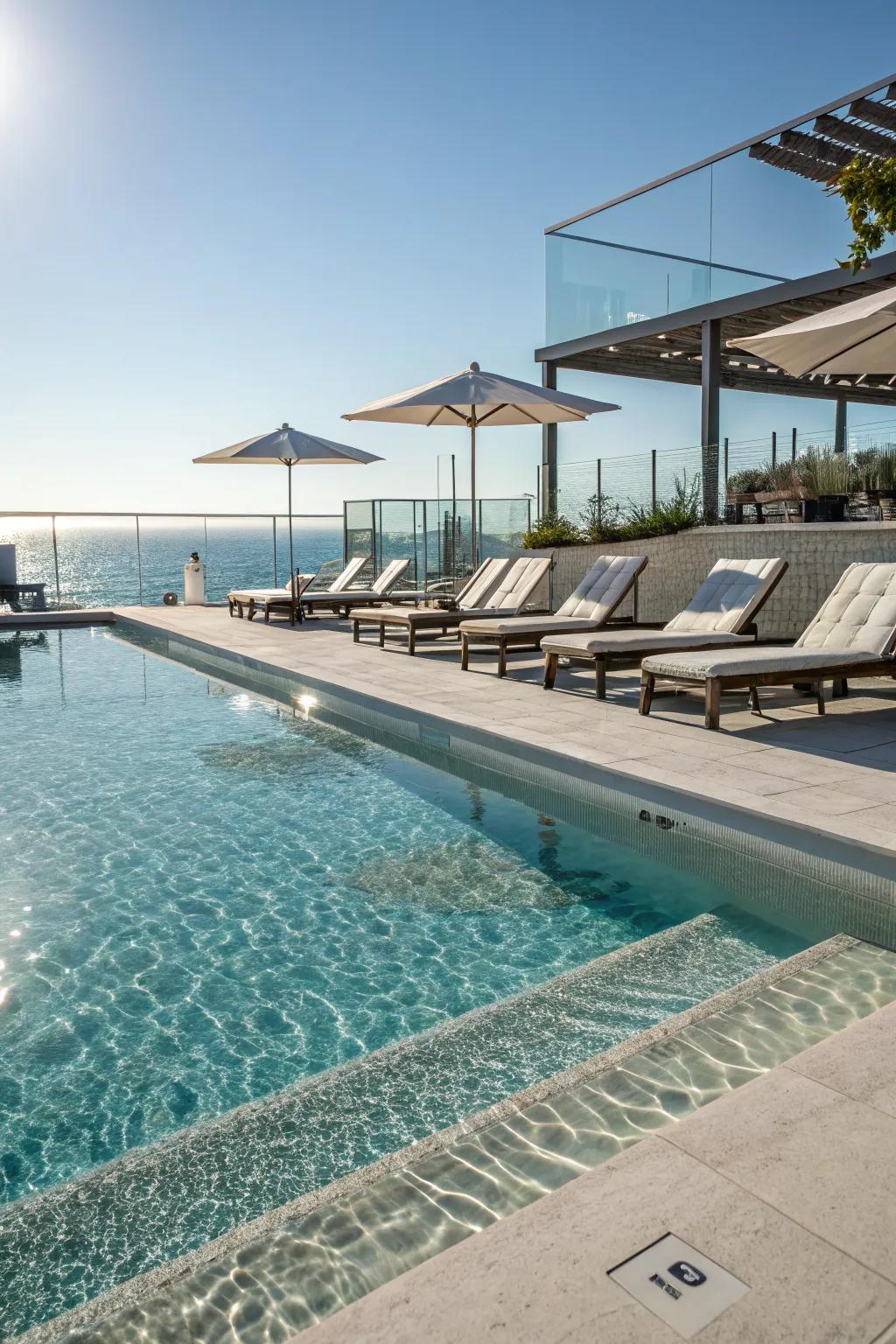 A pool with a relaxing tanning ledge perfect for sunbathing.