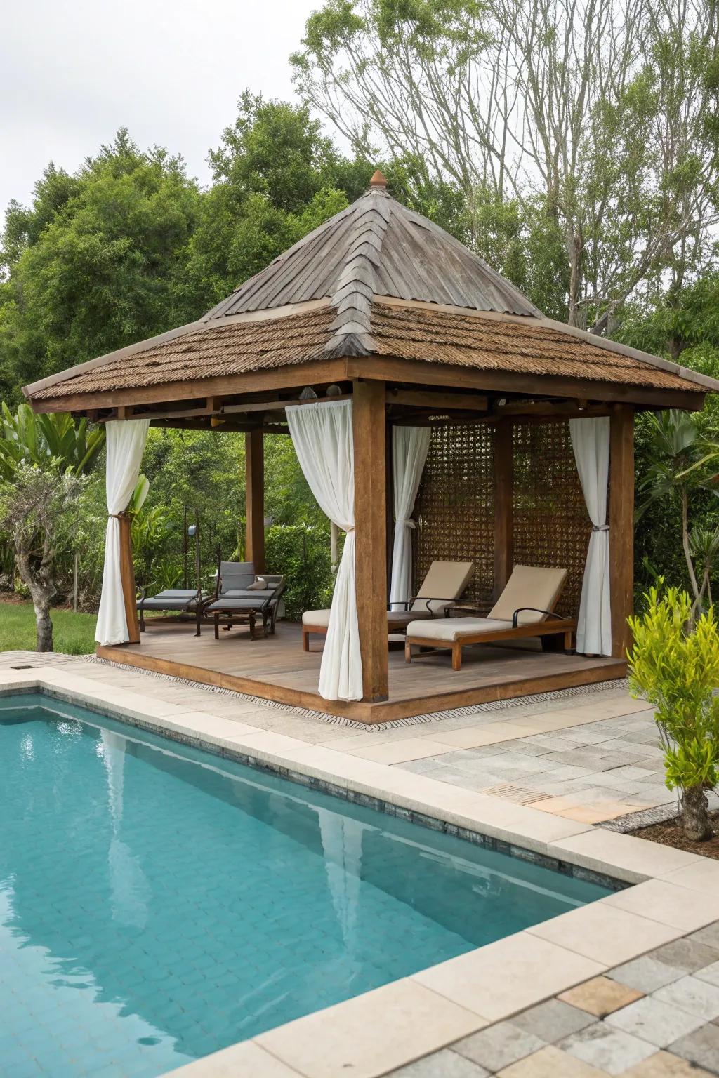 A poolside pavilion offering shade next to a swimming pool.