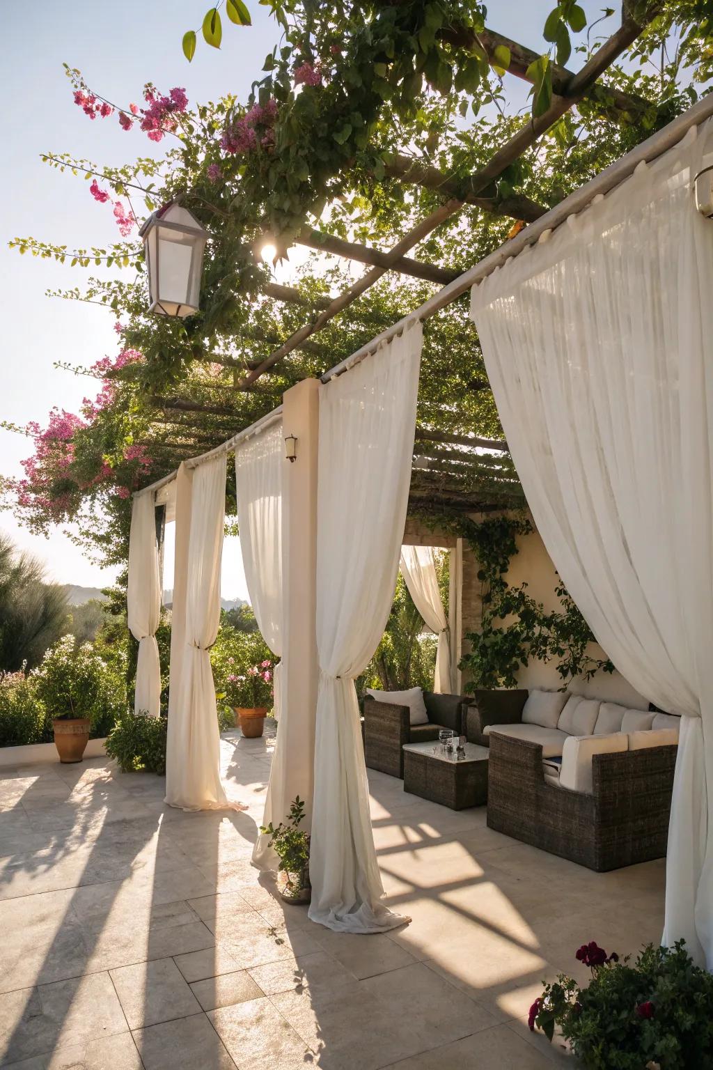 A pergola with curtains offering privacy and style.