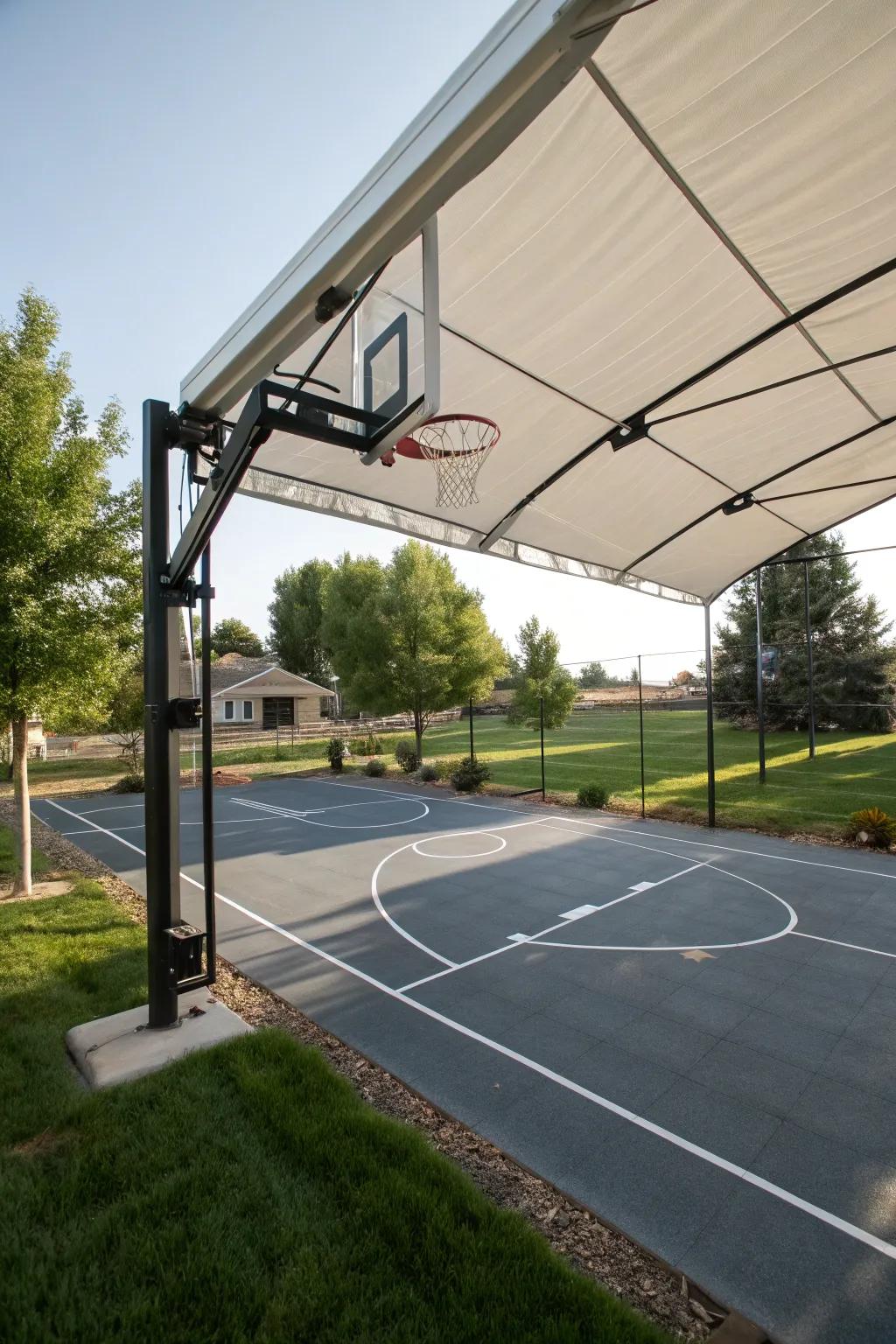 A basketball court equipped with a retractable canopy for shade.
