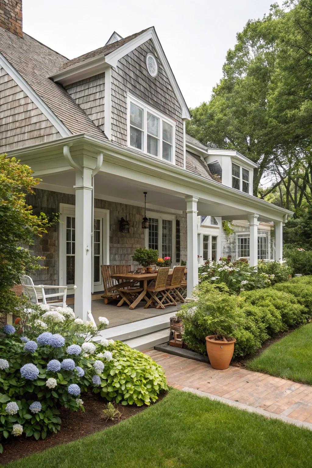 A seamless blend of porch and patio on a Cape Cod house.