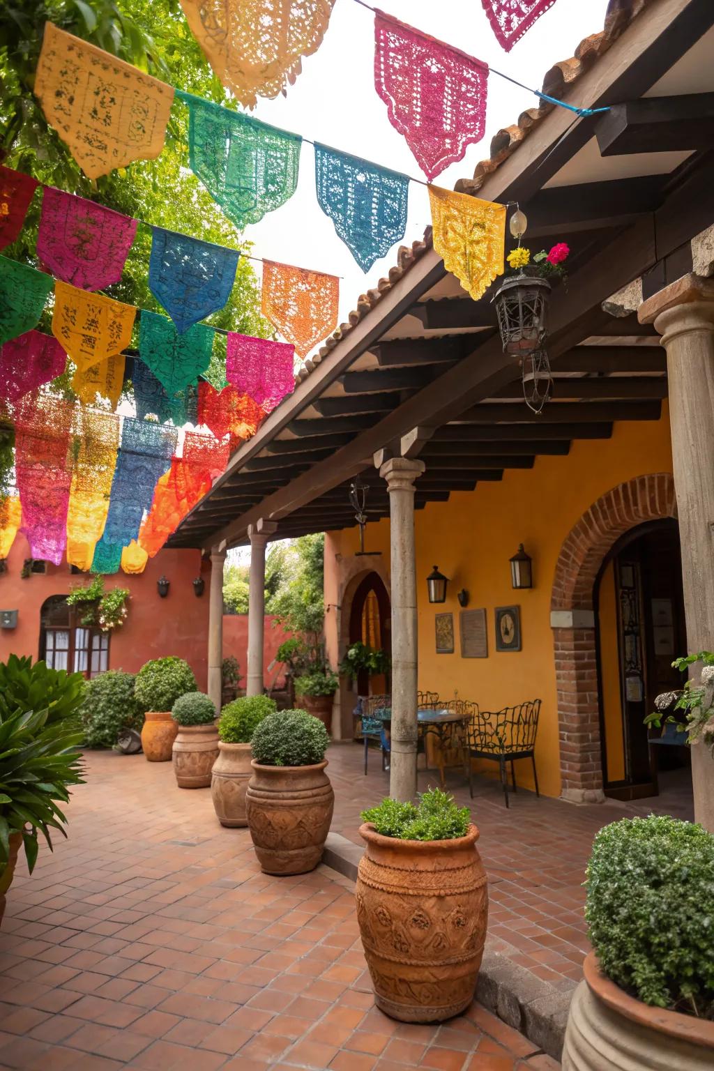 A Mexican patio decorated with colorful papel picado banners, creating a festive atmosphere.