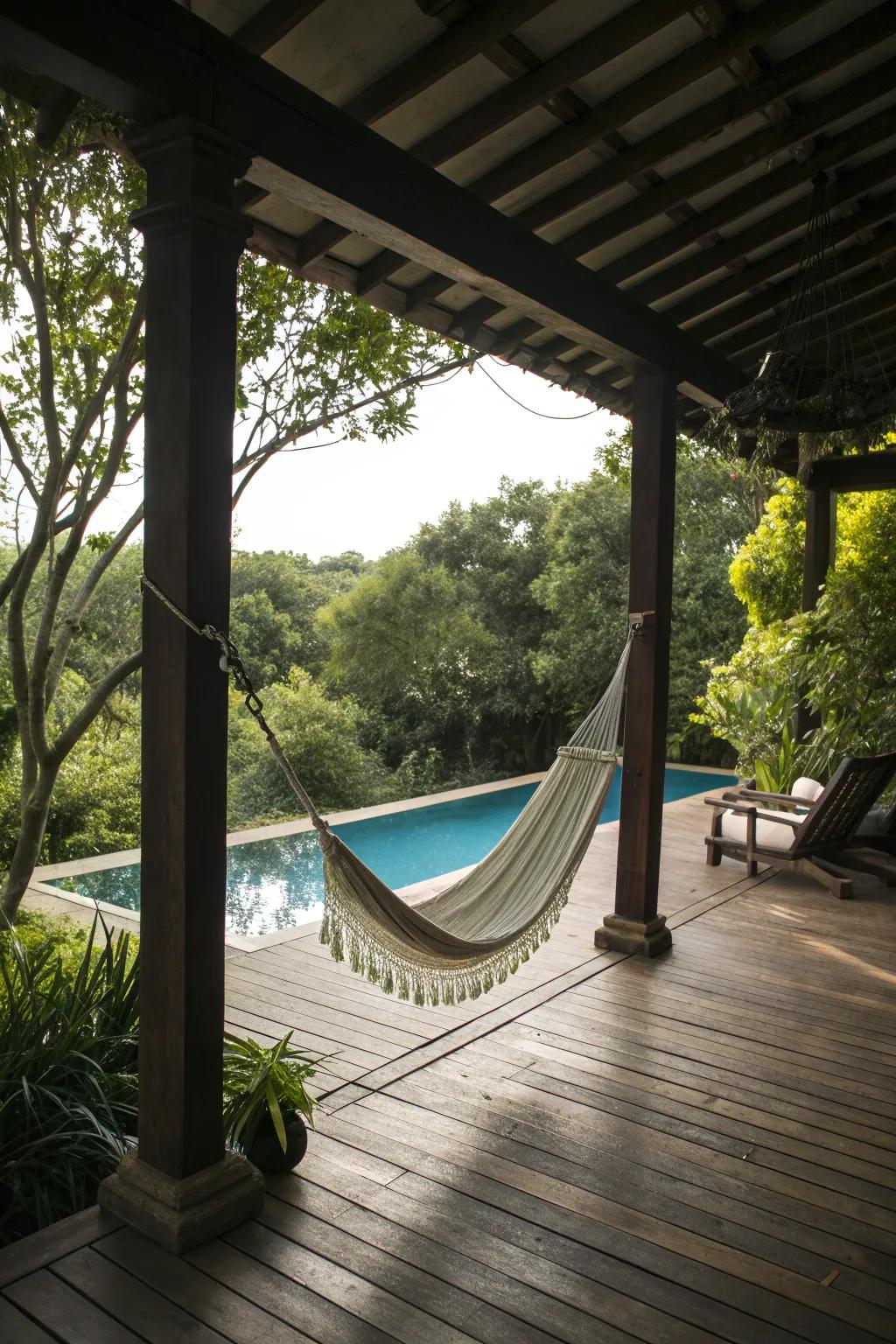 A tranquil poolside porch featuring a cozy hammock.