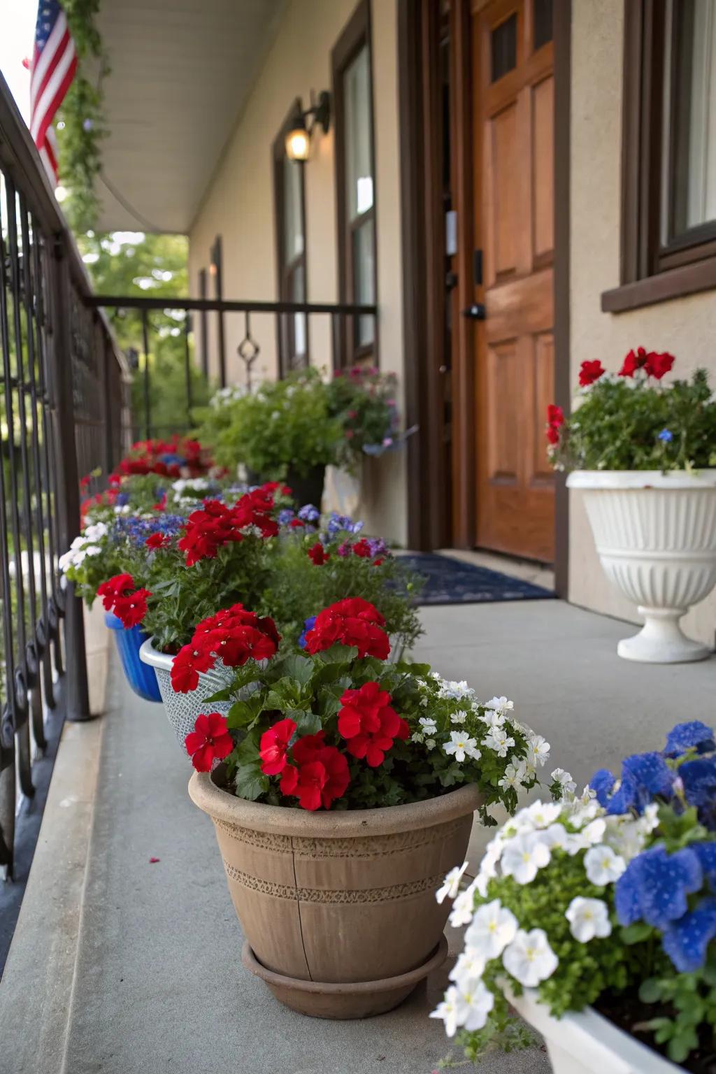 A porch adorned with patriotic-themed flower pots.