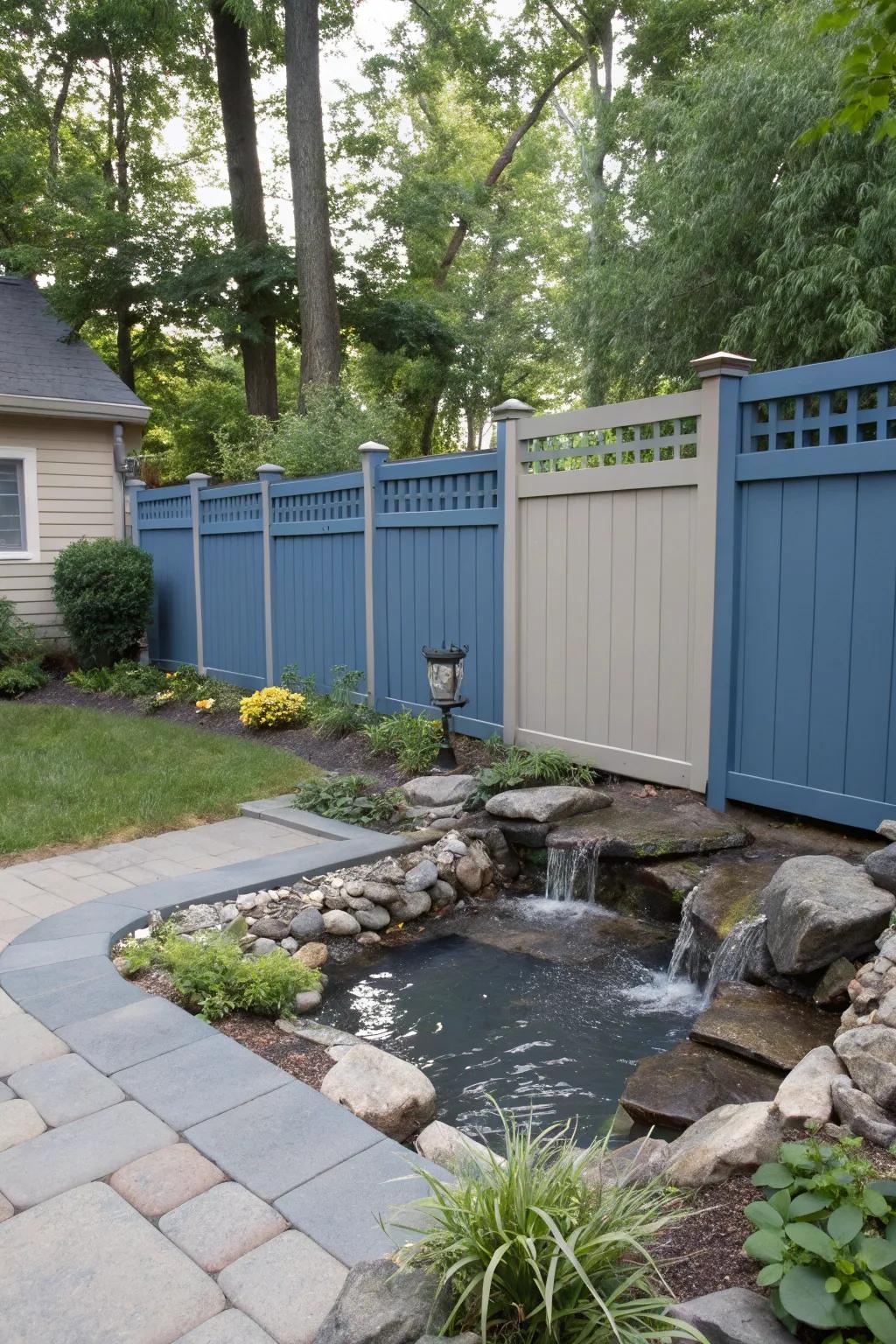 Blue and gray fence creating a peaceful retreat in your backyard.